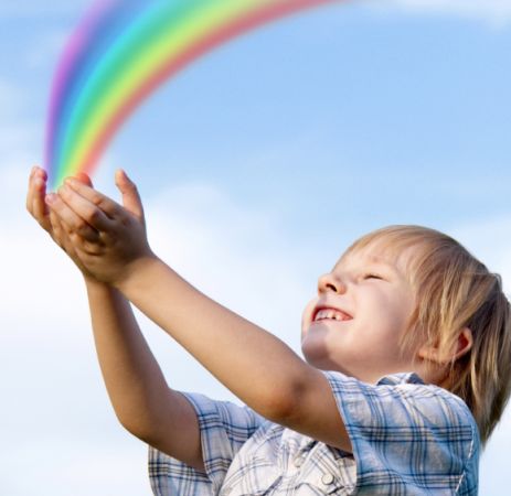 The little boy with stretched hands to sky