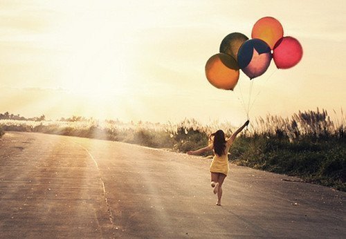 girl-running-with-balloons